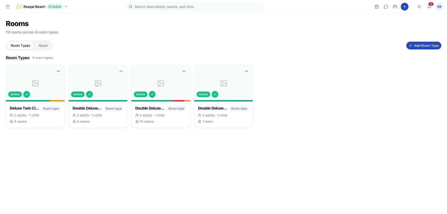 The Rooms screen on the Room Types tab, showing a card per room type with its occupancy and room count.